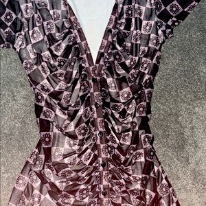 Vibrant stretchy print dress worn once size Large runs small .